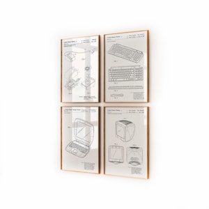 May include: Four framed patent prints featuring vintage computer technology. The prints include diagrams of a keyboard, laptop, monitor, and other computer components. The frames have a light brown wooden finish, and the prints are displayed against a white wall.