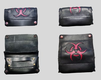 Black leather cigarette case with red biohazard symbol