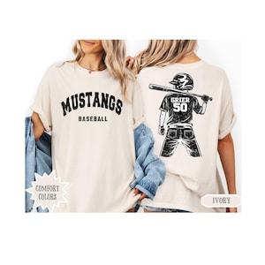 May include: A white ceramic mug with a black handle and the text "But First, Coffee" in a black, bold font. The mug is on a white surface. The mug is approximately 4 inches tall.