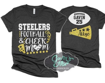 May include: Two black t-shirts with gold glitter designs. The front shirt says "Steelers Football & Cheer Mom" with a football and a megaphone. The back shirt says "Gavin 25" with a football and "Allye" with a megaphone.
