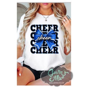 May include: White t-shirt with a blue and black cheer bow and the word "cheer" repeated four times.