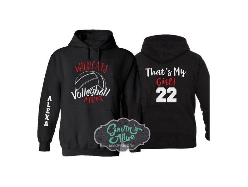 May include: Two black hooded sweatshirts. One sweatshirt has the text "Wildcats Volleyball Mom" with a volleyball graphic. The other sweatshirt has the text "That's My Girl! 22".