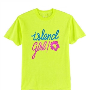May include: Neon yellow t-shirt with the text "island girl!" in blue, pink, and white glitter lettering. A pink glitter flower is next to the text.