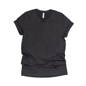 May include: A dark gray V-neck t-shirt with rolled up sleeves.