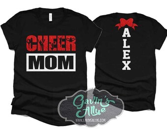May include: Two black t-shirts with red glitter text. The front shirt says "Cheer Mom" with red glitter cheerleaders. The back shirt says "Alex" with a red glitter bow.