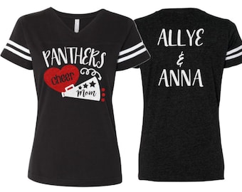 May include: Two black and white football jersey style shirts. The front shirt has the text "Panthers cheer mom" with a red heart and a white megaphone. The back shirt has the text "Allye & Anna".