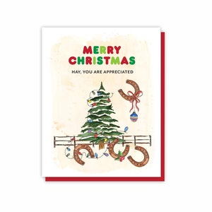 May include: A Christmas greeting card with a red border. The card features a watercolor illustration of a Christmas tree, horseshoes, and the text "MERRY CHRISTMAS HAY, YOU ARE APPRECIATED" in colorful letters.