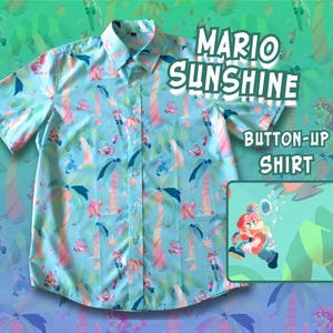 May include: Light blue button-up shirt with a colorful pattern featuring palm trees and cartoon characters. The shirt has short sleeves and a classic collar. Text on the shirt reads "Mario Sunshine Button-Up Shirt".