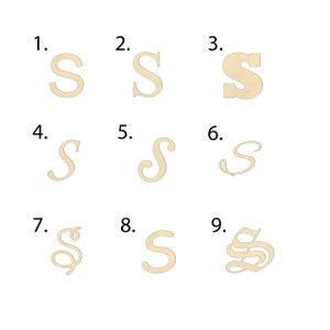 May include: Nine different styles of the letter "S" in a beige color. The letter "S" is shown in a variety of fonts and styles, including a simple block font, a cursive font, and a more ornate font.