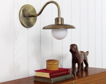 Muir Wall Sconce -- transitional industrial glass globe brass curved arm light lamp fixture