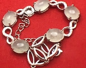 Grade A natural translucent to clear A grade Jade Jadeite Beacelet with white natural diamond accents. Size 8 quot