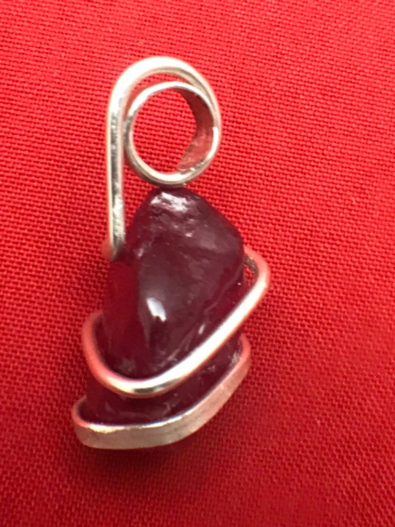 Natural Ruby set into a Sterling Silver art wrap pendant