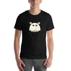 May include: Black t-shirt featuring a cartoon ghost-like creature with large eyes and ears. The creature is white with gray accents and is centered on the front of the shirt. The shirt is made of a soft material.