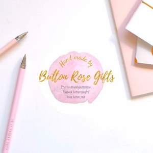 May include: A pink watercolor circle with gold text that reads "Hand made by Button Rose Gifts" and includes social media handles for Etsy, Facebook, and Instagram.