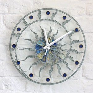 Minimalist blue glass wall clock painted by hand - Original skeleton table clock - Fossil Ammonite decor - Transparent stain glass clock