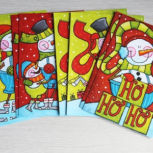 set of 8 Christmas cards with snowman theme, red and green, without text