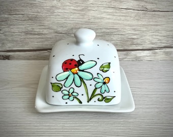 Small square ceramic butter dish hand painted with ladybugs and turquoise flowers, polka dots