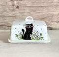 butter dish with black cat with white flowers, black polka dots