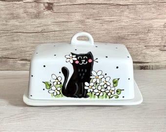 butter dish with black cat with white flowers, black polka dots