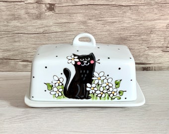 butter dish with black cat with white flower, black polka dots