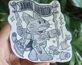 May include: Black and white illustration of a cat wearing a cape and holding a staff with a banner that reads "Animal Liberation". The cat is surrounded by small mice.