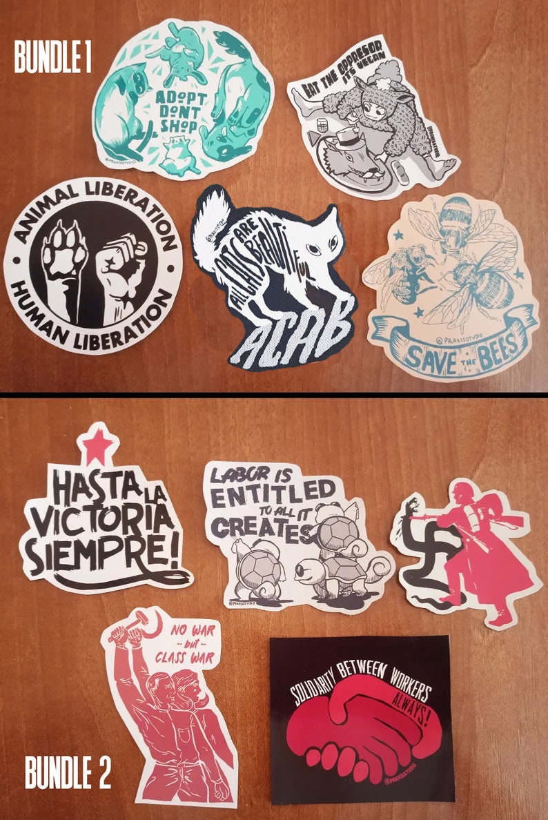 May include: Two sets of stickers with various political and social messages. The first set includes stickers with messages like "Adopt Don't Shop", "Animal Liberation, Human Liberation", "All Cats Are Beautiful", "Eat the Oppressor", and "Save the Bees". The second set includes stickers with messages like "Hasta la Victoria Siempre", "Labor is Entitled to All it Creates", "No War but Class War", and "Solidarity Between Workers Always!"
