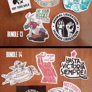 May include: A set of 14 stickers featuring various designs, including a cow, bees, a bunny, a wolf, a paw print, a chain, a handshake, and a communist symbol. The stickers are printed on white paper with black, red, and blue ink. The stickers are arranged in two rows, with the top row labeled "Bundle 13" and the bottom row labeled "Bundle 14".