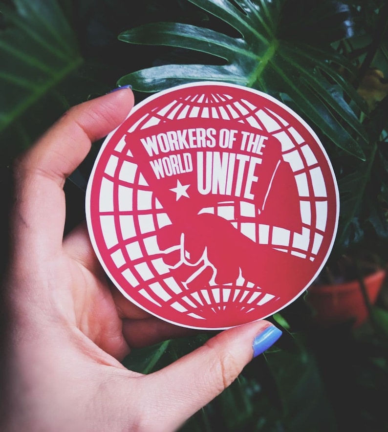 May include: Red and white circular sticker with a globe design and the text "Workers of the World Unite" with a white star.