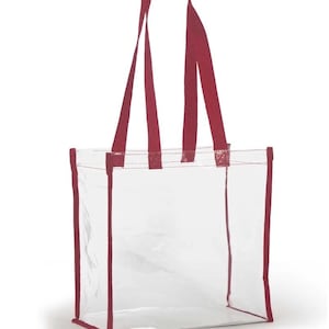 May include: Clear plastic tote bag with red handles and trim. The bag is empty.