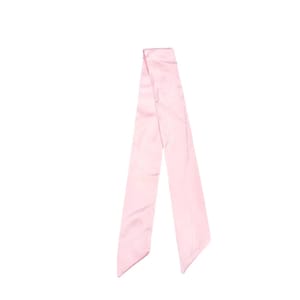 May include: A light pink satin scarf, displayed against a white background. The scarf is long and rectangular, with a smooth, shiny texture. The ends are cut at an angle. This accessory can be used as a hair accessory or neck scarf.