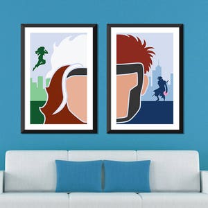 May include: Two framed minimalist posters with a blue background. The left poster features a white and red silhouette of a woman with a green silhouette of a woman in the background. The right poster features a red silhouette of a man with a black silhouette of a man in the background.
