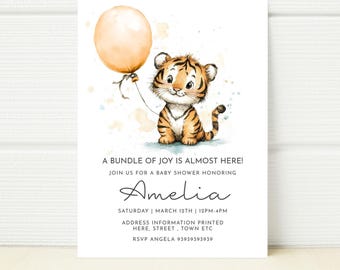 May include: A baby shower invitation with a watercolour illustration of a tiger cub holding an orange balloon. The invitation includes the text "A BUNDLE OF JOY IS ALMOST HERE!" and event details, including the name "Amelia".