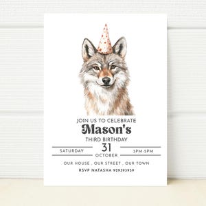 May include: A birthday party invitation featuring a watercolor illustration of a wolf wearing a red and white polka dot party hat. The text reads "Join us to celebrate Mason's Third Birthday, Saturday, October 31, 3PM-5PM, Our house, our street, our town, RSVP Natasha 929393939."