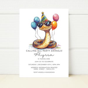 May include: A birthday party invitation with a cartoon snake wearing sunglasses and a party hat, holding balloons. The invitation reads "CALLING ALL PARTY ANIMALS! Alyssa is turning one."