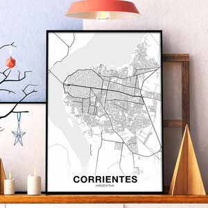 May include: Black and white map print of Corrientes, Argentina. The map shows the city streets and surrounding area.