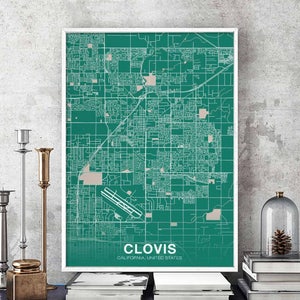 May include: A green and white map print of Clovis, California, United States. The map shows the city's streets and landmarks. The print is framed in a white frame.
