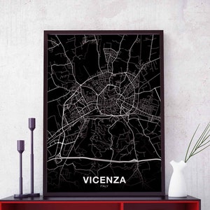 May include: Black and white city map print of Vicenza, Italy, with the city name and country printed at the bottom of the map.