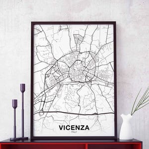 May include: Black and white map print of Vicenza, Italy, in a black frame. The map shows the city streets and surrounding area.