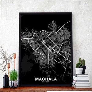 May include: Black and white city map print of Machala, Ecuador. The map is framed in a black frame and is hanging on a wall.