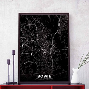 May include: Black and white map print of Bowie, Maryland, United States. The map is framed in a black frame and is hanging on a white wall.