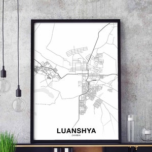 May include: A black and white map print of Luanshya, Zambia, in a black frame. The map shows the city's streets and landmarks.