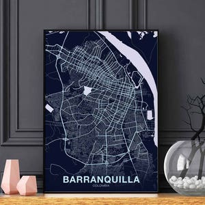 May include: A navy blue map print of Barranquilla, Colombia. The map shows the city's streets and waterways. The city name is printed in white at the bottom of the map.