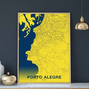 May include: A yellow and blue map print of Porto Alegre, Brazil. The map shows the city's streets and coastline.