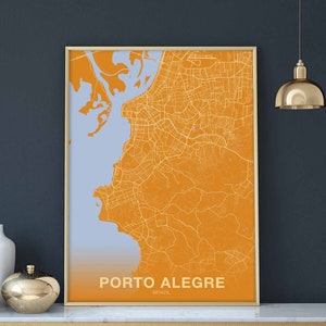 May include: A framed map of Porto Alegre, Brazil, in shades of orange and light blue. The city map is detailed, showing streets and waterways. The text "PORTO ALEGRE" and "BRAZIL" are printed at the bottom of the map.