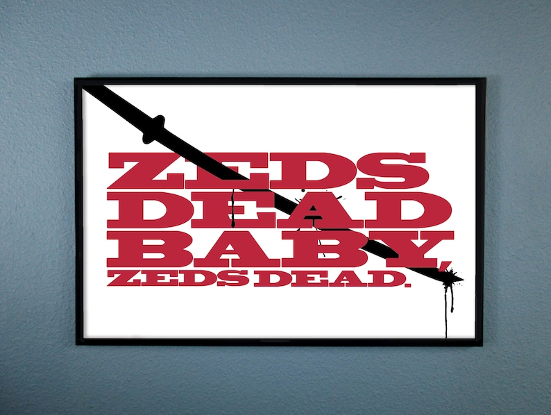 Puede incluir: Una impresi&oacute;n gr&aacute;fica en blanco y negro con el texto "ZEDS DEAD BABY ZEDS DEAD." en letras rojas. El gr&aacute;fico presenta una espada negra con una gota roja.