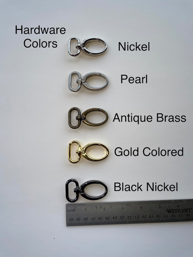 May include: Five different metal swivel clasps in various finishes: nickel, pearl, antique brass, gold colored, and black nickel. A ruler is shown for scale.