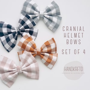 May include: Set of four gingham bow headbands in black and white, gray and white, brown and white, and pink and white. The bows are handmade and are labeled "Cranial Helmet Bows Set of 4 Handkrfted Handmade by Katrina Rose".