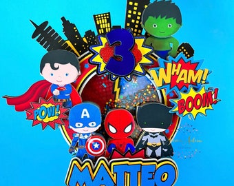 May include: A superhero themed cake topper in red, yellow and blue. The topper features a cityscape, the number 3, and various superhero characters including Superman, Spiderman, Captain America, Hulk and Batman. The topper also includes the words "POW!" "WHAM!" "BOOM!" and the name "MATTEO".