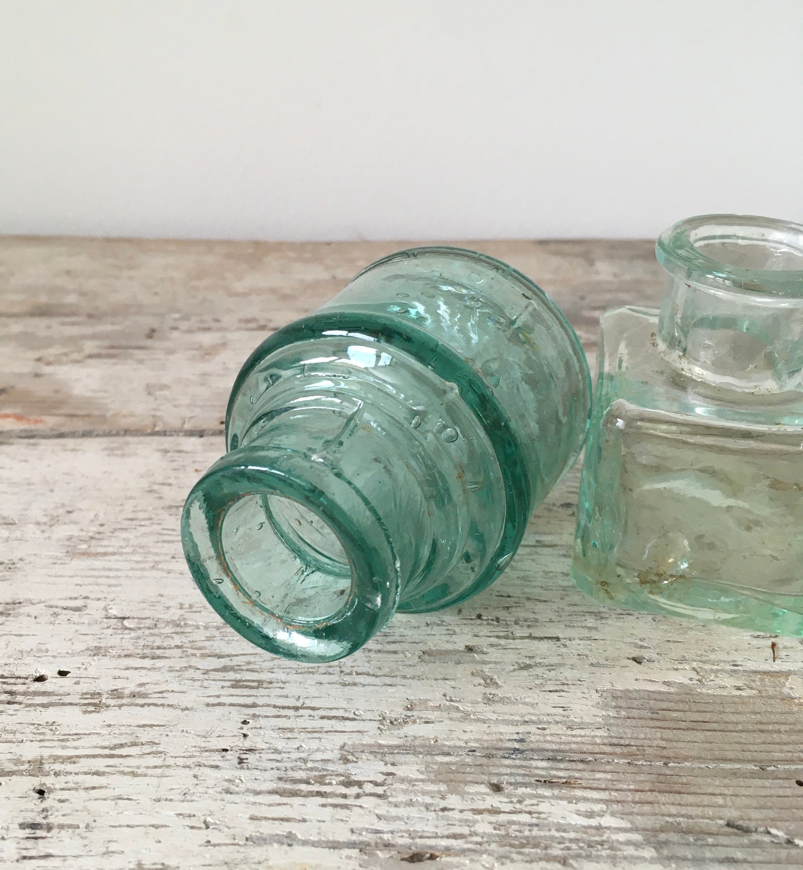 Set of 5 antique ink bottles.