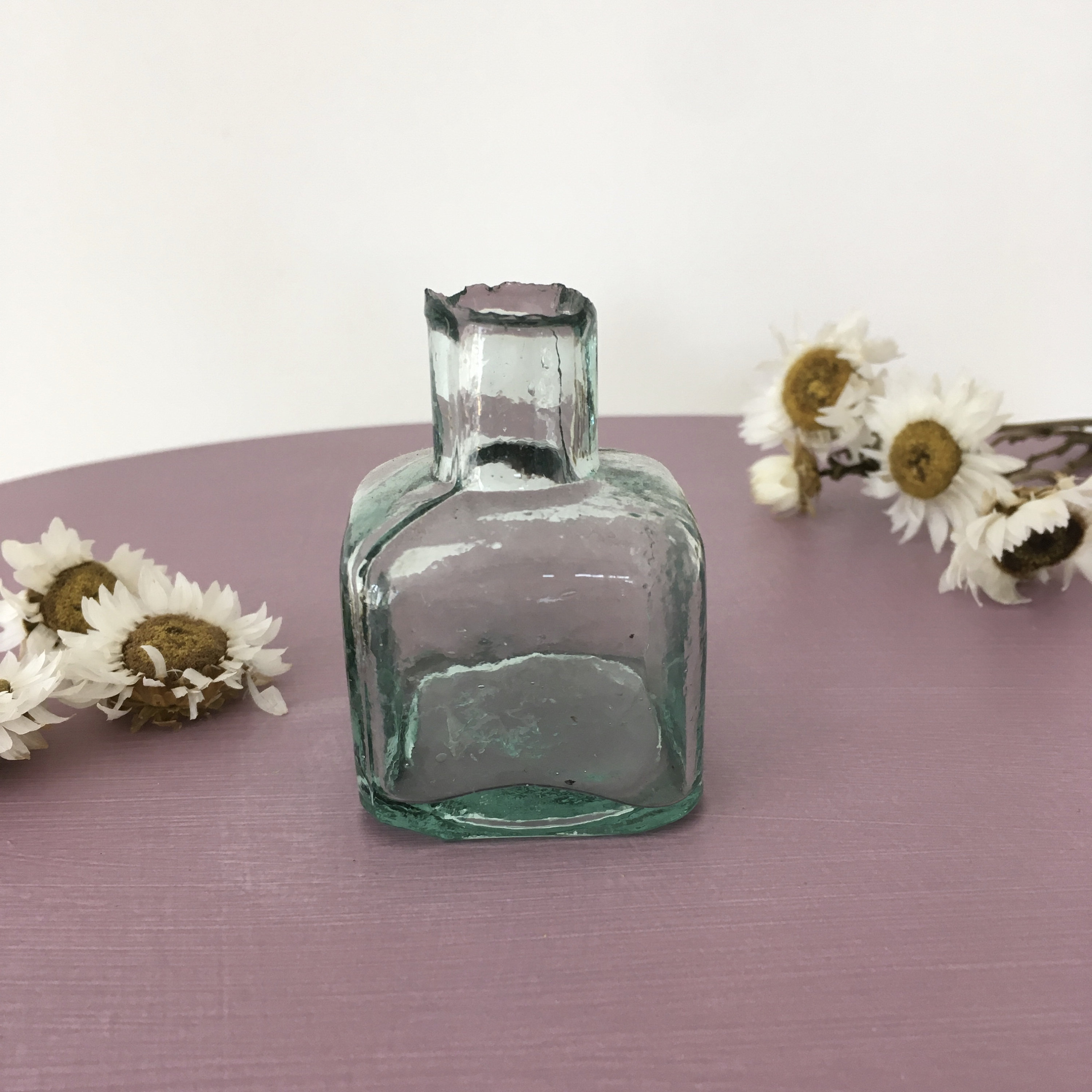 Set of 3 antique ink bottles.